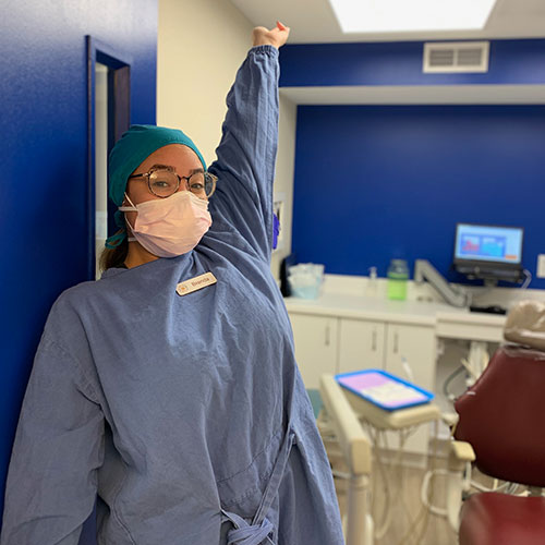 a staff member leaning on the door
