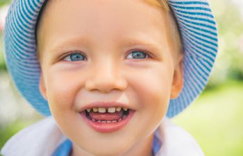 Cute Little Boy With Blue Eyes Closeup