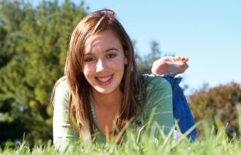 Teenage girl relaxing in the grass